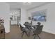 Bright dining room with modern table and chairs, open to kitchen at 2923 Palora Ave, Las Vegas, NV 89121