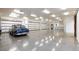 Spacious garage with polished concrete floor and ample space for multiple cars at 3888 W Pebble Rd, Las Vegas, NV 89139