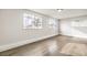 Bright bedroom with wood-look floors and two large windows at 4450 San Rafael Ave, Las Vegas, NV 89120