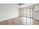 Living area with light wood flooring and French doors leading to the backyard at 4450 San Rafael Ave, Las Vegas, NV 89120