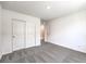 Well-lit bedroom, grey carpet, and double door closet at 4558 Aqua Landing Ave # Lot 33, Las Vegas, NV 89115