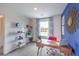 Bright home office featuring a wooden desk and built-in shelving at 4830 Currant Ridge Ave # 71, Las Vegas, NV 89141