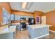 Kitchen with gray cabinets, stainless steel appliances, and island at 5041 Vista Del Rancho Way, North Las Vegas, NV 89031