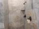 Large shower with marble tile and dual shower heads at 7017 Arcadia Creek St, North Las Vegas, NV 89084