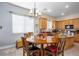 Kitchen with light wood cabinets, granite countertops, and an island at 748 Ishani Ridge Ct, Pahrump, NV 89048