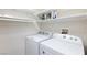 Laundry closet with washer, dryer, and shelving at 8501 W University Ave # 1016, Las Vegas, NV 89147