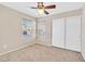 Bright bedroom with two windows, ceiling fan and closet at 9539 Brewing Cloud Ave, Las Vegas, NV 89148