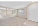 Bright living room with neutral carpeting and an open floor plan at 9539 Brewing Cloud Ave, Las Vegas, NV 89148