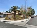 Two-story house with attached garage and palm trees at 6633 Wheelbarrow Peak Dr, Las Vegas, NV 89108