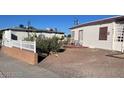 Small front yard with gravel and desert landscaping at 203 W Pacific Ave, Henderson, NV 89015