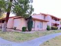 Condo building exterior view, showing landscaping and building details at 1515 E Reno Ave # A108, Las Vegas, NV 89119