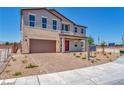 Two-story house with brown garage door and red front door at 7151 Serene Creek St, Las Vegas, NV 89131