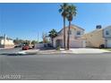 Two-story house with a light-pink exterior and a two-car garage at 5402 Night Swim Ln, Las Vegas, NV 89113