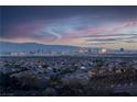 Aerial view of community with city skyline in background at 348 Unicorn Hills Dr, Henderson, NV 89012