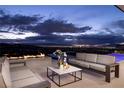 Outdoor seating area with fire pit and city views at 643 Cityview Ridge Dr, Henderson, NV 89012