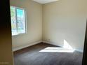 Well-lit bedroom with carpeted floor and window at 10096 Goff Grove Ct, Las Vegas, NV 89183