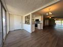 Open concept dining area with kitchen view and wood floors at 1390 Vegas Valley Dr # 36, Las Vegas, NV 89169