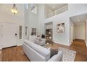 Bright and airy living room with high ceilings and hardwood floors at 167 Rising Mesa Ct, Henderson, NV 89012