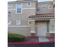 Building exterior with tan stucco and tiled roof at 5855 Valley Dr # 2097, North Las Vegas, NV 89031