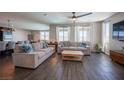 Open living room with hardwood floors and lots of natural light at 12502 Dolan Point St, Las Vegas, NV 89138