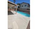 Inviting backyard pool with covered patio at 7349 Dolphine Crest Ave, Las Vegas, NV 89129