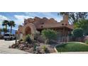 Two-story stucco home with landscaped yard and driveway at 920 Vista Del Sol Ct, Mesquite, NV 89027