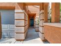 Covered entryway leading to front door of home at 8058 Torremolinos Ave, Las Vegas, NV 89178