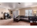 Living room with L-shaped sofa and home office at 8600 W Charleston Blvd # 2190, Las Vegas, NV 89117