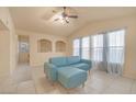 Bright living room featuring vaulted ceilings and a teal sectional sofa at 10001 Peace Way # 2322, Las Vegas, NV 89147