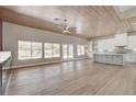 Open concept kitchen with island, white cabinets, and modern appliances at 9201 Cactus Wood Dr, Las Vegas, NV 89134