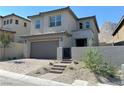 Two-story home with modern exterior and landscaping at 11816 River Hawk Ave, Las Vegas, NV 89138