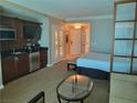 King bedroom with kitchenette and sitting area at 135 E Harmon Ave # 2416, Las Vegas, NV 89109