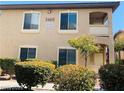 Exterior view of a tan building with landscaping at 3460 Cactus Shadow St # 101, Las Vegas, NV 89129