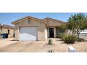 Front view of a single-story house with a gravel driveway at 457 E Merlayne Dr, Henderson, NV 89011