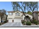 Two-story house with a three-car garage and manicured lawn at 3179 Surf Spray St, Las Vegas, NV 89117