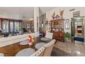 Dining area with a wood table and views to living room at 918 Derringer Ln, Henderson, NV 89014