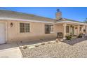 Single-story house with attached garage and landscaped yard at 3192 Taylor St, Logandale, NV 89021