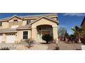 Two-story house with a three-car garage and arched entryway at 4798 Luna Ridge Ct, Las Vegas, NV 89129