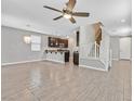 Open living room with tile floors and kitchen views at 7046 Town Forest Ave, Las Vegas, NV 89179