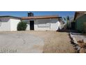 Exterior view of home with front entrance at 1932 Lawry Ave, North Las Vegas, NV 89032