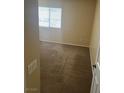 Simple bedroom with carpeted floor and window with blinds at 3639 Bufflehead St, Las Vegas, NV 89122