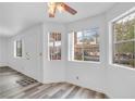 Bright living room featuring vinyl wood flooring and large windows at 813 Mesquite Springs Dr # 101, Mesquite, NV 89027