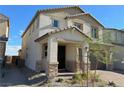 Two-story house with a covered entryway and landscaping at 7148 Port Stephens St, North Las Vegas, NV 89084