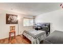 Bright bedroom with a comfortable bed and wood floors at 4770 Topaz St # 18, Las Vegas, NV 89121