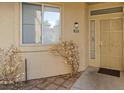 Front door entrance with security door and landscaping at 5155 W Tropicana Ave # 1099, Las Vegas, NV 89103