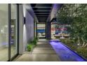 Lighted water feature leading to living room with city views at 9 Boulderback Dr, Henderson, NV 89012