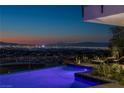 Luxury pool with city views at sunset at 9 Boulderback Dr, Henderson, NV 89012