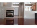 Living room with hardwood floors and a gas fireplace at 1625 Pacific Tide Pl, Las Vegas, NV 89144