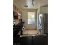 Kitchen with stainless steel appliances and granite counters at 5523 Jose Leon St, North Las Vegas, NV 89031