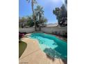 Freeform swimming pool with surrounding patio furniture at 9801 Bradford Summit St, Las Vegas, NV 89183